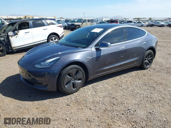 2020 Tesla Model 3 Standard Range Plus with VIN 5YJ3E1EA5LF644282, listed as a IAAI auction lot 41710124 with 69,969 mi miles and . Bid and sale history available at DreamBid. Image 2.