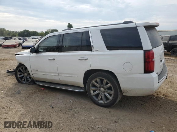 2015 Chevrolet Tahoe LTZ with VIN 1GNSKCKC1FR310018, listed as a Copart auction lot 71798454 with 244,179 mi miles and Salvage title. Bid and sale history available at DreamBid. Image 2.