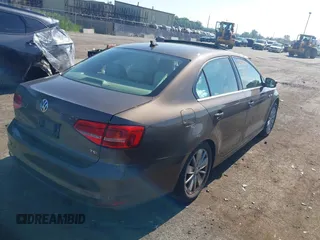 2015 Volkswagen Jetta Sport z VIN 3VWD17AJ5FM411217, wystawiony jako IAAI lot #42563776 z przebiegiem 84 520 mil mil oraz . Historia ofert i sprzedaży dostępna na DreamBid. Obrazek 4.