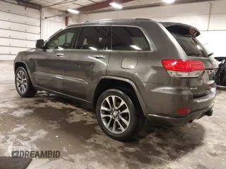 2017 Jeep Grand Cherokee Overland z VIN 1C4RJFCG6HC641812, wystawiony jako IAAI lot #42053404 z przebiegiem 129 184 mil mil oraz . Historia ofert i sprzedaży dostępna na DreamBid. Obrazek 3.