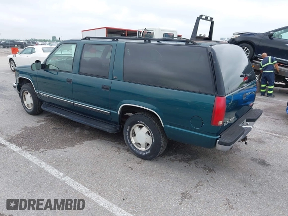 1996 GMC Suburban z VIN 1GKFK16ROTJ725925, wystawiony jako IAAI lot #42244433 z przebiegiem 123 837 mil mil oraz . Historia ofert i sprzedaży dostępna na DreamBid. Obrazek 3.