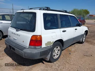 1999 Subaru Forester L with VIN JF1SF6353XH741228, listed as a IAAI auction lot 39377894 with 156,243 mi miles. Bid and sale history available at carsss.com. Image 4.