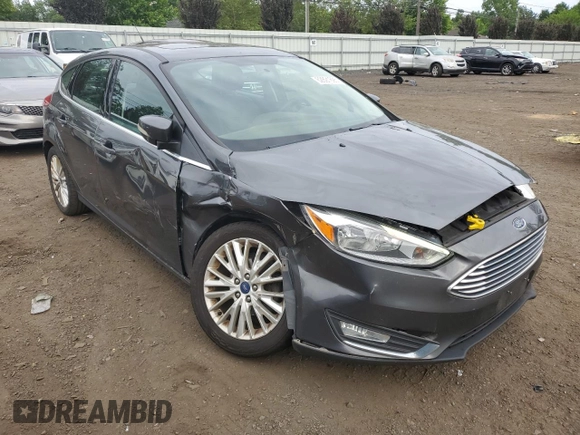 2017 Ford Focus Titanium z VIN 1FADP3N29HL240527, wystawiony jako Copart lot #62891695 z przebiegiem 126 926 mil mil oraz Szkoda całkowita • Salvage title. Historia ofert i sprzedaży dostępna na DreamBid. Obrazek 4.