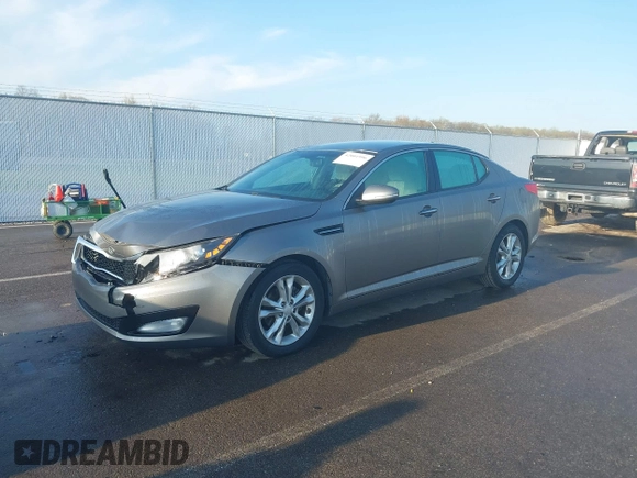 2013 Kia Optima EX with VIN 5XXGN4A77DG101902, listed as a IAAI auction lot 42001996 with 143,469 mi miles and . Bid and sale history available at DreamBid. Image 2.