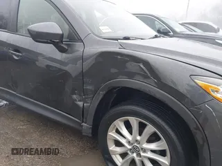 2014 Mazda CX-5 Grand Touring with VIN JM3KE4DY0E0392476, listed as a IAAI auction lot 41419144 with 89,245 mi miles and . Bid and sale history available at carsss.com. Image 6.