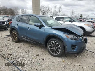 2016 Mazda CX-5 Grand Touring z VIN JM3KE4DY2G0637779, wystawiony jako Copart lot #52001805 z przebiegiem 184 381 mil mil oraz Czysty tytuł • Clean title. Historia ofert i sprzedaży dostępna na DreamBid. Obrazek 4.