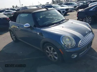 2010 MINI Convertible with VIN WMWMR3C53ATU97865, listed as a IAAI auction lot 41610670 with 154,457 mi miles and . Bid and sale history available at DreamBid. Image 1.