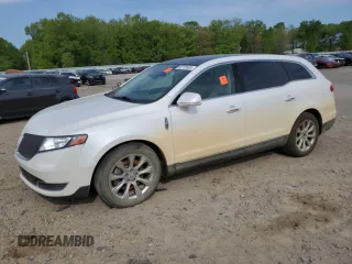 2014 Lincoln MKT EcoBoost z VIN 2LMHJ5AT9EBL50397, wystawiony jako Copart lot #52720565 z przebiegiem 117 372 mil mil oraz Szkoda całkowita • Salvage title. Historia ofert i sprzedaży dostępna na DreamBid. Obrazek 1.