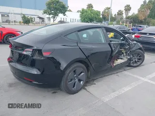 2023 Tesla Model 3 with VIN 5YJ3E1EA5PF647737, listed as a IAAI auction lot 42430145 with 20,525 mi miles and . Bid and sale history available at DreamBid. Image 4.