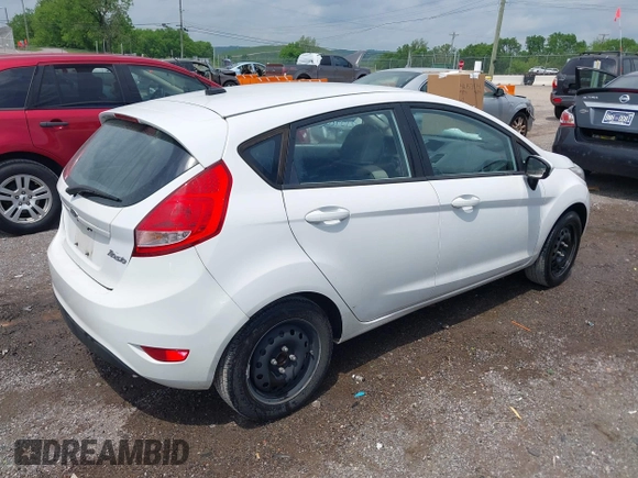 2013 Ford Fiesta S with VIN 3FADP4TJ4DM164594, listed as a IAAI auction lot 42154202 with 75,860 mi miles and . Bid and sale history available at DreamBid. Image 4.