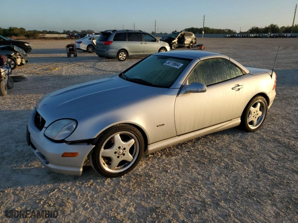 2001 Mercedes-Benz SLK-Class with VIN WDBKK65F31F230678, listed as a Copart auction lot 84119664 with 94,941 mi miles and Salvage Title. Bid and sale history available at carsss.com. Image 1.