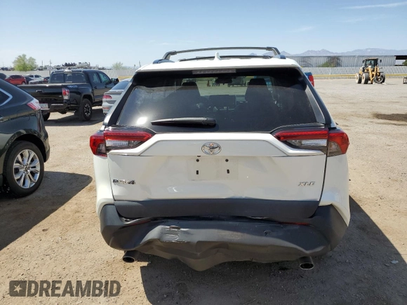 2021 Toyota RAV4 XLE Premium with VIN 2T3C1RFV0MW153089, listed as a Copart auction lot 60759615 with 28,153 mi miles and Salvage title. Bid and sale history available at DreamBid. Image 6.