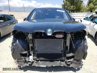 2024 BMW iX xDrive50 with VIN WB523CF05RCN96948, listed as a Copart auction lot 50858304 with 8,923 mi miles and Salvage Title. Bid and sale history available at carsss.com. Image 5.