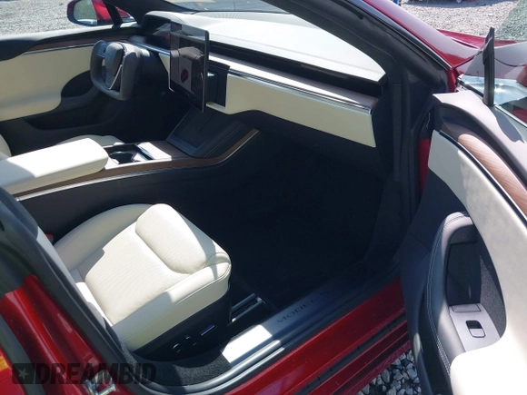 2023 Tesla Model S with VIN 5YJSA1E5XPF516779, listed as a IAAI auction lot 42110737 with 16,465 mi miles and . Bid and sale history available at DreamBid. Image 5.