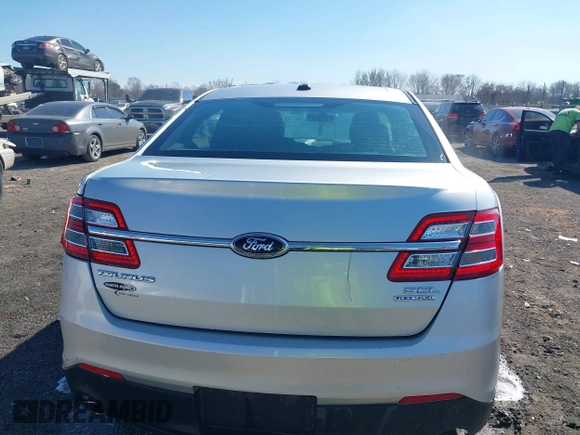 2013 Ford Taurus SEL with VIN 1FAHP2E8XDG164903, listed as a IAAI auction lot 41580690 with 163,128 mi miles and . Bid and sale history available at carsss.com. Image 16.