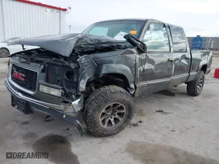 1999 GMC Sierra 2500 Crew Cab with VIN 1GTGK23R3XF050476, listed as a IAAI auction lot 41630143 with 158,655 mi miles. Bid and sale history available at carsss.com. Image 2.