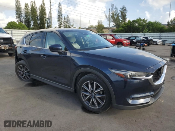 2018 Mazda CX-5 Grand Touring with VIN JM3KFADMXJ1353942, listed as a Copart auction lot 60570835 with 74,400 mi miles and Clean title. Bid and sale history available at DreamBid. Image 4.