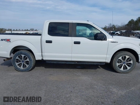 2019 Ford F-150 XL with VIN 1FTEW1E51KFC52807, listed as a IAAI auction lot 41383212 with 124,244 mi miles and . Bid and sale history available at DreamBid. Image 13.