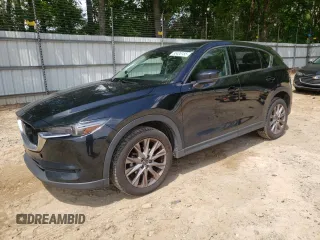 2019 Mazda CX-5 Grand Touring with VIN JM3KFADM9K0608894, listed as a Copart auction lot 55426155 with 98,263 mi miles and Salvage title. Bid and sale history available at DreamBid. Image 1.