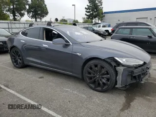 2014 Tesla Model S 60 with VIN 5YJSA1S14EFP56277, listed as a Copart auction lot 57162685 with Not provided miles and Salvage title. Bid and sale history available at DreamBid. Image 4.