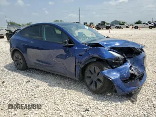 2024 Tesla Model Y Long Range with VIN 7SAYGAEE6RF196245, listed as a Copart auction lot 54667765 with 10,336 mi miles and Salvage title. Bid and sale history available at DreamBid. Image 4.