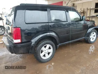 2007 Dodge Nitro SXT with VIN 1D8GT28K67W683600, listed as a IAAI auction lot 40958011 with 70,141 mi miles. Bid and sale history available at carsss.com. Image 4.