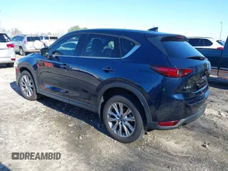 2021 Mazda CX-5 Grand Touring with VIN JM3KFADM5M0428279, listed as a IAAI auction lot 41747175 with 49,579 mi miles. Bid and sale history available at carsss.com. Image 3.