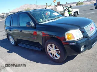 2006 GMC Envoy Denali with VIN 1GKES63M062290131, listed as a IAAI auction lot 41586286 with 165,699 mi miles. Bid and sale history available at carsss.com. Image 1.