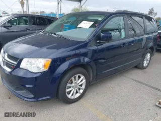 2015 Dodge Grand Caravan SXT Plus with VIN 2C4RDGCG7FR649032, listed as a IAAI auction lot 41825774 with 128,521 mi miles. Bid and sale history available at carsss.com. Image 2.