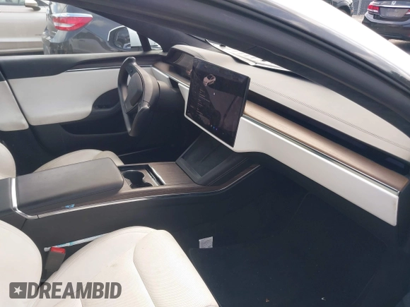 2021 Tesla Model S Long Range with VIN 5YJSA1E57MF428512, listed as a IAAI auction lot 42511020 with 29,611 mi miles and . Bid and sale history available at DreamBid. Image 5.