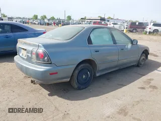 1996 Honda Accord EX w/Leather with VIN 1HGCD5666TA055580, listed as a IAAI auction lot 42021014 with 300,191 mi miles. Bid and sale history available at carsss.com. Image 4.