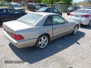 1999 Mercedes-Benz SL-Class with VIN WDBFA68F1XF183885, listed as a IAAI auction lot 42085175 with 133,333 mi miles. Bid and sale history available at carsss.com. Image 4.