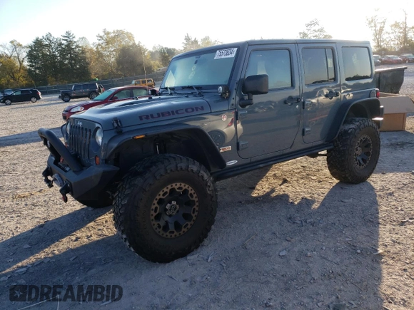 2013 Jeep Wrangler Unlimited Rubicon 10th Anniversary z VIN 1C4HJWFG0DL704100, wystawiony jako Copart lot #75573634 z przebiegiem 103 158 mil mil oraz Szkoda całkowita • Salvage title. Historia ofert i sprzedaży dostępna na DreamBid. Obrazek 1.