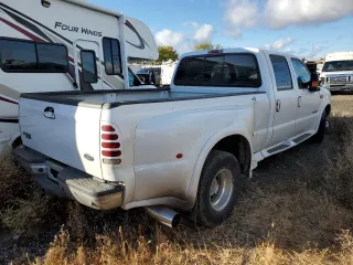 2001 Ford F-350 XL with VIN 1FTWW32F31ED39867, listed as a Copart auction lot 80069644 with 241,113 mi miles and Salvage title. Bid and sale history available at DreamBid. Image 3.
