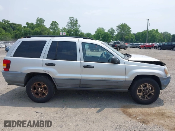2002 Jeep Grand Cherokee Laredo with VIN 1J4GW48SX2C313093, listed as a IAAI auction lot 42446559 with 200,319 mi miles and . Bid and sale history available at DreamBid. Image 13.