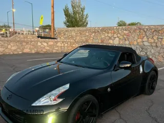 2014 Nissan 370Z Touring with VIN JN1AZ4FH1EM620177, listed as a Copart auction lot 54388235 with 107,509 mi miles and Salvage Title. Bid and sale history available at carsss.com. Image 2.