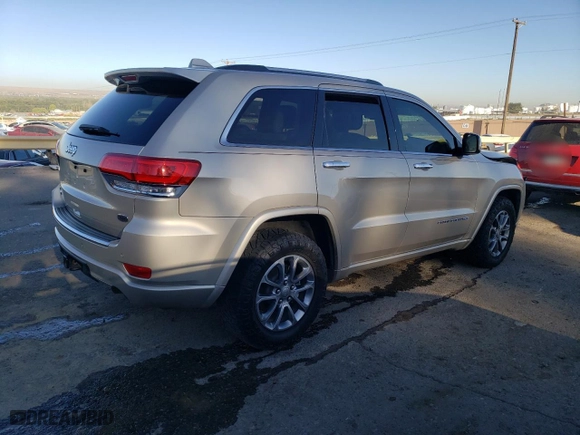 2014 Jeep Grand Cherokee Overland with VIN 1C4RJFCM2EC556953, listed as a Copart auction lot 73046974 with 106,889 mi miles and Salvage Title. Bid and sale history available at carsss.com. Image 3.