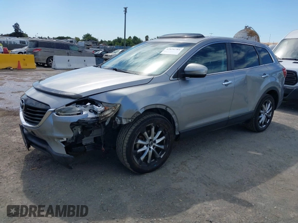 2014 Mazda CX-9 Grand Touring z VIN JM3TB2DVXE0432991, wystawiony jako IAAI lot #42826784 z przebiegiem 134 265 mil mil oraz . Historia ofert i sprzedaży dostępna na DreamBid. Obrazek 2.