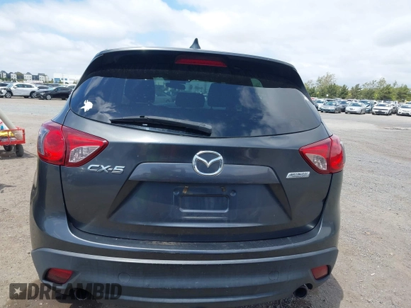 2014 Mazda CX-5 Sport with VIN JM3KE2BE0E0411377, listed as a IAAI auction lot 42143229 with 137,384 mi miles and . Bid and sale history available at carsss.com. Image 16.