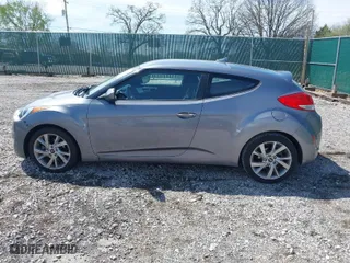 2017 Hyundai Veloster with VIN KMHTC6AD8HU305853, listed as a IAAI auction lot 41915404 with 115,663 mi miles. Bid and sale history available at carsss.com. Image 14.