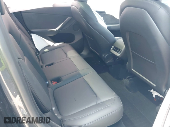 2024 Tesla Model Y with VIN 7SAYGDED9RA321373, listed as a IAAI auction lot 42228491 with 6,452 mi miles and . Bid and sale history available at DreamBid. Image 8.