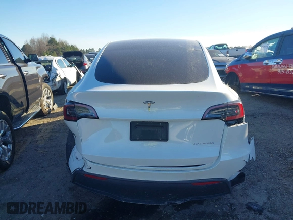 2023 Tesla Model Y Long Range with VIN 7SAYGAEE3PF753657, listed as a IAAI auction lot 41668917 with 33,301 mi miles and . Bid and sale history available at DreamBid. Image 17.