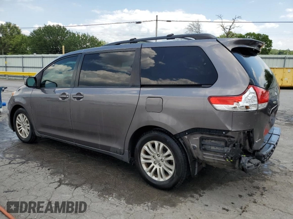 2014 Toyota Sienna XLE with VIN 5TDYK3DC6ES456558, listed as a Copart auction lot 63106085 with 231,260 mi miles and Salvage title. Bid and sale history available at DreamBid. Image 2.