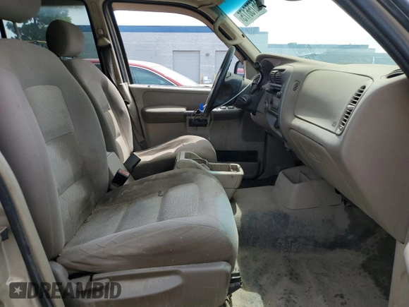 2005 Ford Explorer Sport Trac XLS with VIN 1FMZU67K05UA59602, listed as a Copart auction lot 56756175 with 136,440 mi miles and Salvage title. Bid and sale history available at DreamBid. Image 7.