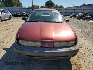 1998 Saturn SL z VIN 1G8ZH528XWZ144301, wystawiony jako Copart lot #75918414 z przebiegiem 219 256 mil mil oraz Szkoda całkowita • Salvage title. Historia ofert i sprzedaży dostępna na DreamBid. Obrazek 5.