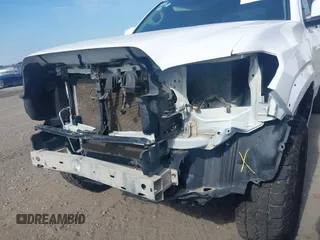 2023 Toyota Tacoma SR with VIN 3TYCZ5AN2PT112854, listed as a IAAI auction lot 42220025 with 43,657 mi miles and . Bid and sale history available at DreamBid. Image 19.