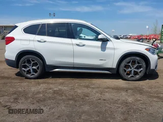2018 BMW X1 xDrive28i with VIN WBXHT3C39J5F91912, listed as a IAAI auction lot 42099647 with 79,023 mi miles and . Bid and sale history available at DreamBid. Image 13.