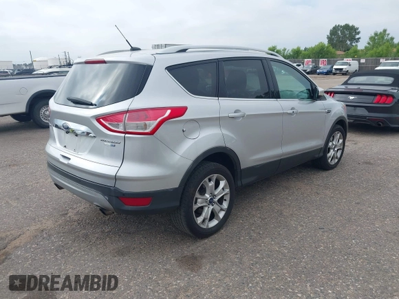 2016 Ford Escape Titanium with VIN 1FMCU9JX3GUC86930, listed as a IAAI auction lot 42582263 with 113,386 mi miles and . Bid and sale history available at DreamBid. Image 4.