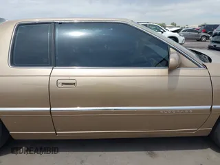 1999 Cadillac Eldorado ESC z VIN 1G6EL12Y5XU603764, wystawiony jako IAAI lot #42368692 z przebiegiem 154 613 mil mil oraz . Historia ofert i sprzedaży dostępna na DreamBid. Obrazek 13.