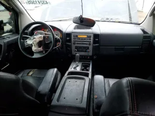 2011 Nissan Titan Pro-4X z VIN 1N6BA0EC2BN325891, wystawiony jako Copart lot #43241505 z przebiegiem Nie podano mil oraz Szkoda całkowita • Salvage title. Historia ofert i sprzedaży dostępna na DreamBid. Obrazek 8.